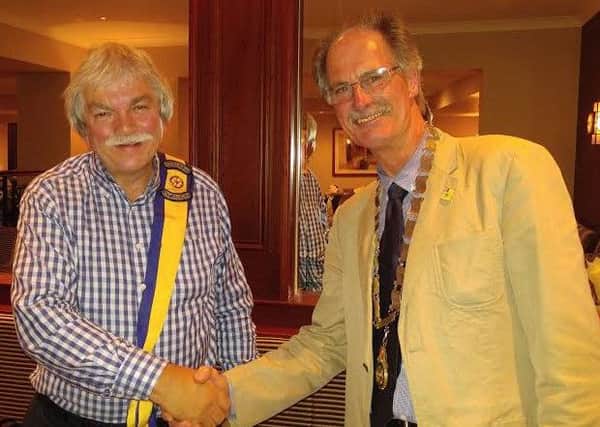 Jim Fitzsimons (right) is congratulated by Leonard Sproule on becoming the new president of the Rotary Club of Newtownabbey for 2016/17. INNT 28-506CON