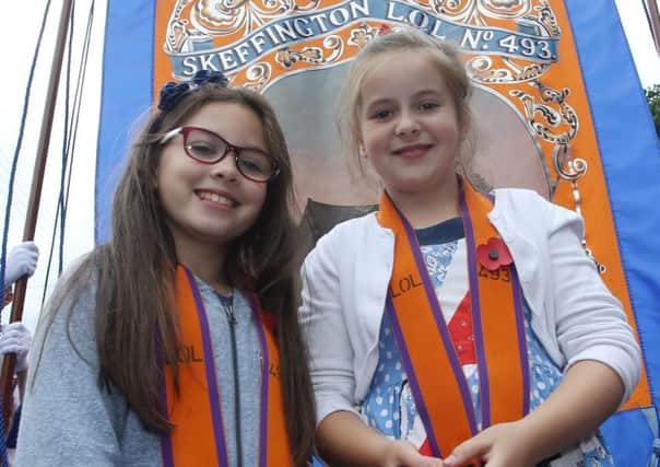 Georgia Dempster and Ella Gunn who carried the strings of the Skeffington LOL 493 banner in the Randalstown parade. INBT 29-316JC