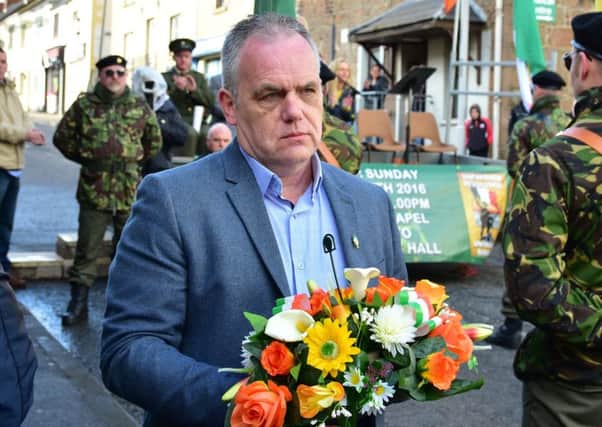 Paul Duffy, brother of Colin prepares to lay a wreath on Barracks Street in Coalisland during The Easter Rising dedication parade in Coalisland on Easter Sunday.