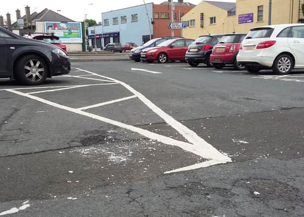 Broken glass in the car park at Larne's Riverdale. INLT-29-714-con