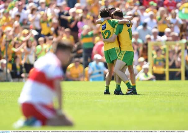 Odhran McFadden-Ferry, left, Eoghan McGettigan, centre, and Niall O'Donnell of Donegal celebrate at the final whistle of the Electric Ireland Ulster GAA Football Minor Championship Final match between Derry and Donegal at St Tiernach's Park in Clones, Co Monaghan. Photo by Ramsey Cardy/Sportsfile