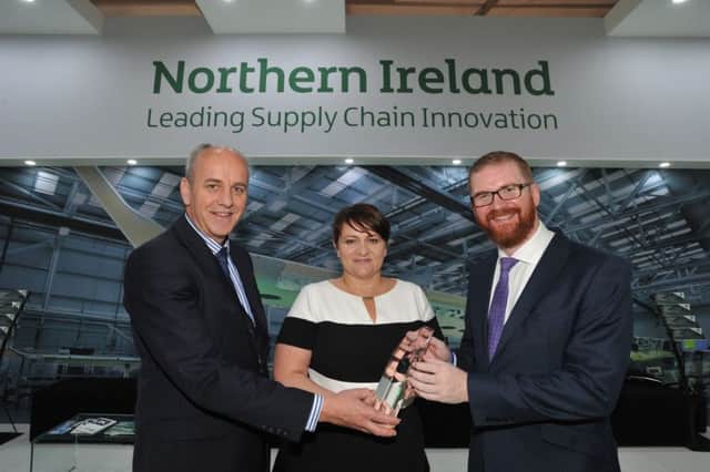 IPC Mouldings received the SC21 Award Silver in B/E Aerospaces Supply Chain Programme at Farnborough International Airshow.  Pictured are Dr Leslie Orr, manager ADS Northern Ireland, Joanne Liddle, managing director IPC Mouldings and Economy Minister Simon Hamilton. INCT 29-757-CON