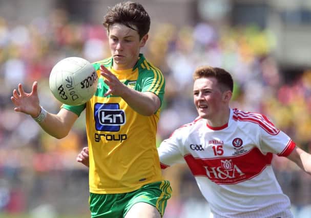 Derry's Eoghan Bradley tries to close down Mark Curran of Donegal during Sunday's Ulster Minor Final in Clones
. (INPHO/Lorraine O'Sullivan)
