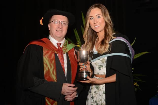 Erin McElvogue is presented with the J.C. Davidson (Memorial) Cup by Dr Peter Hamill who was guest speaker at the Stranmillis University College prize presentation. INCT 29-791-CON