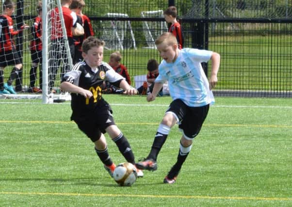 Action from Carniny Youth under-11s' Foyle Cup match against Albion Stars.