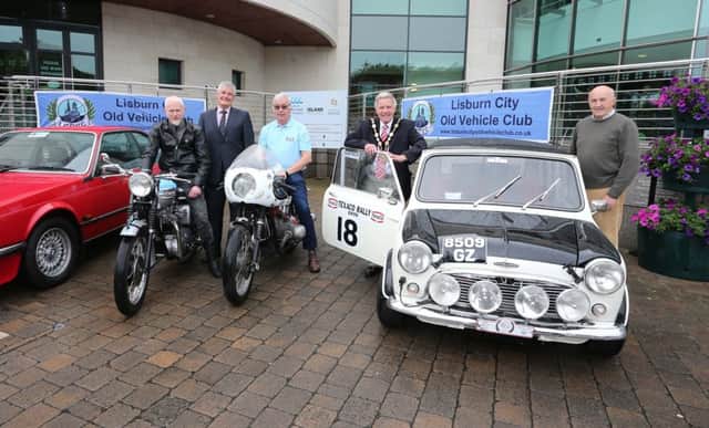 Pictured at the launch of the Classic Car and Motorcycle Parade that will take place on Monday 8th August are: Paul Hunter; Councillor Tim Morrow, Chairman of the Council's Leisure & Community Development Committee; Syd McCoy, Lisburn City Old Vehicle Club Secretary; the Mayor, Councillor Brian Bloomfield MBE and Ronnie Nesbitt, owner of the Mini Cooper S and ex RUC Q car. INUS Ulster 4
