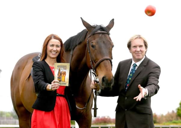 Julia Galbraith, Magners Brand Manager, joins Mike Todd, Down Royals General Manager, to launch the Magners Race Evening that takes place on Friday 22 July at Down Royal racecourse. Pic by Matt Mackey / Press Eye