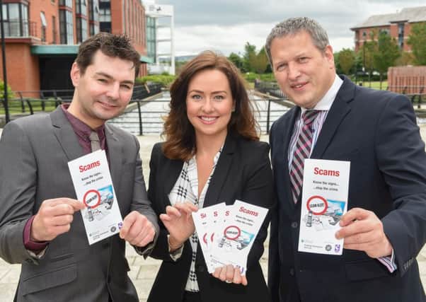 L-R: Ronan Convery, Consumer Council; Laura Kane, Trading Standards Service and Gabriel Moran, Police Service of Northern Ireland are pictured with the new Scams - Know the signs ...stop the crime leaflet,