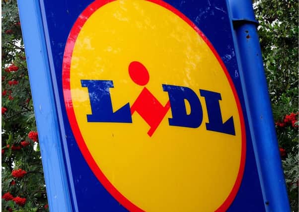 Undated file photos of the logos for Aldi and Lidl, as the latest industry data shows that that the German discounters have enjoyed three months of booming growth as more than half of British households visited at least one of the stores. PRESS ASSOCIATION Photo. Issue date: Tuesday September 22, 2015. Tesco, Britain's biggest supermarket, saw sales slide 1% as its market share fell by 0.6% to 28.2%, while Asda retained second position despite market share falling to 16.7%, with sales down by 2.9% compared with a year ago, figures from Kantar Worldpanel show. See PA story CITY Supermarkets. Photo credit should read: PA/PA Wire