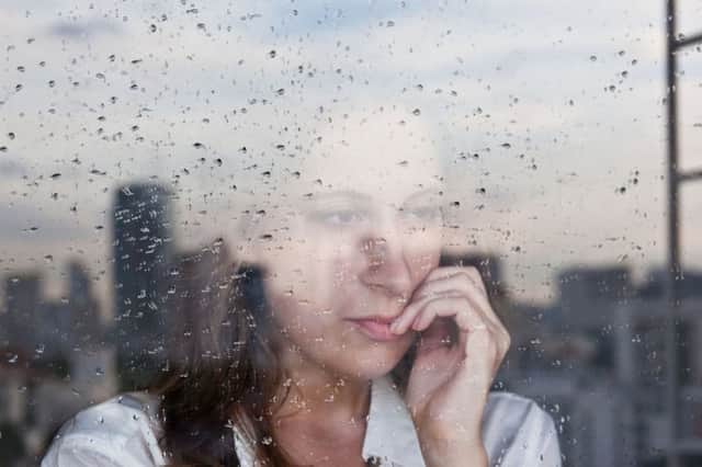 A Generic Photo of depressed woman looking out of a window. See PA Feature WELLBEING Suicide. Picture credit should read: PA Photo/thinkstockphotos. WARNING: This picture must only be used to accompany PA Feature WELLBEING Suicide.