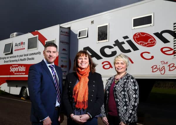 Action Cancer patron Nuala McKeever, centre, joins Sean Conlon from the charity and SuperValu Marketing Manager Donna Morrison, to announce the Big Bus visit to Centra Larne. INLT-30-718-con