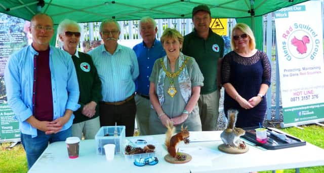 Glens Red Squirrels group with MLA Oliver McMullan,Alderman Maura Hickey, Mayor of CCG and Orla Black community foundation.