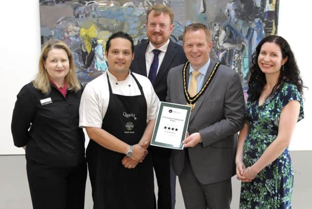 The FE McWilliam Gallery & Studio has again been awarded a Tourism Northern Ireland, Four Star Visitor Attraction Certificate, celebrating the event is Deputy Lord Mayor Cllr Paul Greenfield, Tourism Facilities Manager Karen McKinstry, Chair of the Economic Development & Regeneration Committee Cllr Colin McCusker, Quails Chef Fernando Correa, and Curator Riann Coulter Â©Edward Byrne Photography INBL1630-206eb