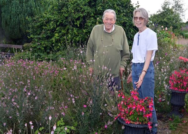 Mr and Mrs John and Erica Lund pictured in their garden at 54 Old Kilmore Road, Moira, which they will be opening to the public on Saturday and Sunday. INLM30-202.