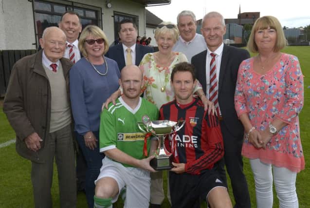 Banbridge Town Captain Ryan Moffatt and Cliftonville Captain Ryan Catney pictured before last year's Bob Larmour Cup match, with Larmour Family members Susan, Yvonne and Elaine, Town President Andrew Cully, Town Chairman Dominic Downey, Cliftonville Patron Jimmy Boyce, Cliftonville Chairman Gerard Lawlor and Fred Jardine Â©Edward Byrne Photography INBL1530-237EB
