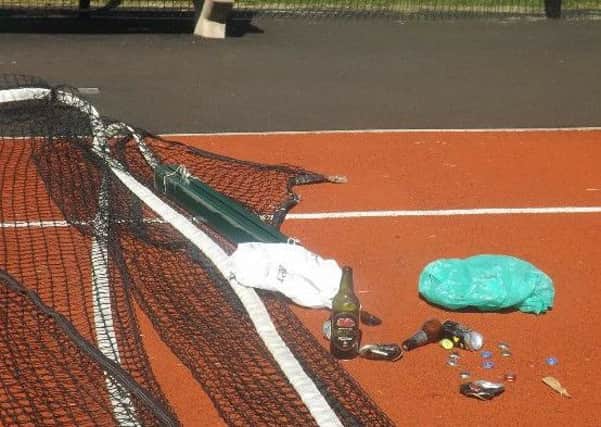 Nets torn down and drinks bottles left on court