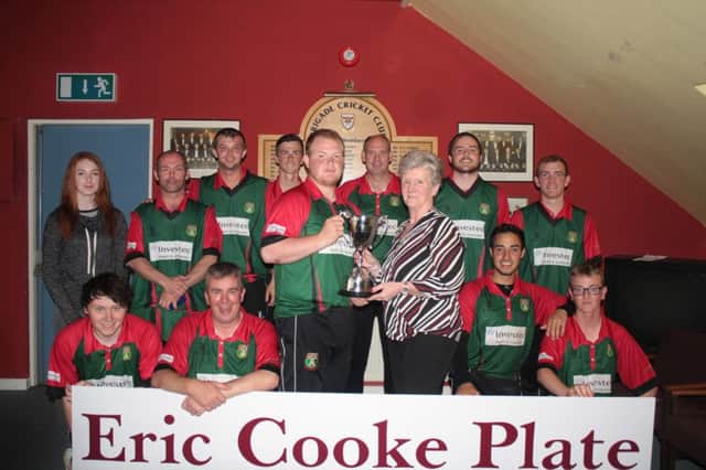 Valerie Cooke presents the Eric Cooke Cup to Ballyspallen skipper Stephen Kennedy. INLS30-Ballyspallen