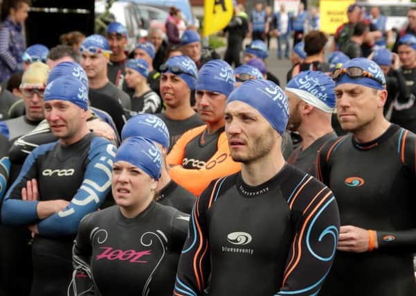 If the cap fits...competitors prepare to take to the water during the Big Splash Triathlon event in Portglenone on Saturday. Pictures courtesy of Damian McKee (Picture Magic Studios).