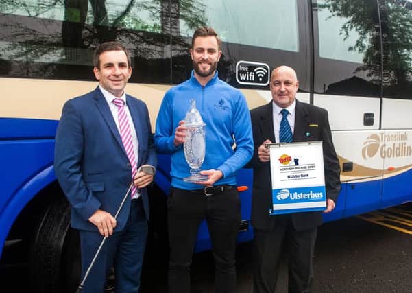 Translink Service Delivery Manager John Morgan and Ulsterbus Inspector Danny Halliday with Galgorm Castles Ross Oliver and the trophy for the Tayto Northern Ireland Open, in partnership with Ulster Bank.