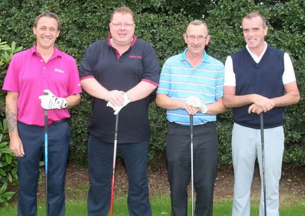 Derek Smith; Mervyn Arbuthnot; Willie Mitchell and Gerry McCartney prepare for their round at Ballymena Golf Club.
