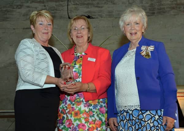 The Lord Lieutenant for Co Antrim, Mrs Joan Christie (right) presented the Queen`s Award for Voluntary Service to Glenarm in Bloom members, Rosaleen Meban and Frances Wilson. INLT 30-002-PSB