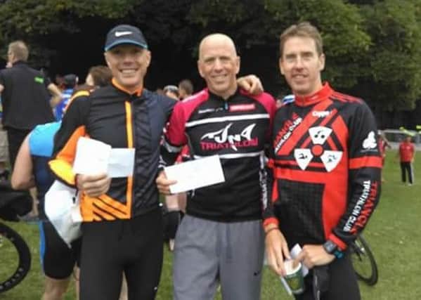 Peter Savage (left) and Paul McManus (centre) of West Down Wheelers who took the two top placings in the Mourne triathlon at the weekend. Peter took first place, with Paul second. Congratulations to both.