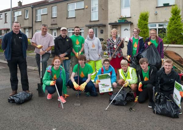 Mayor of Mid and East Antrim , Councillor Audrey Wales pictured at the spruce-up in the Doury Road area of Ballymena with members of Doury Road Development Group, young volunteers from High Kirk Church, and officers from Environmental Health team all helping to make the local  environment cleaner, tidier and more pleasant to live and work in. (Submitted Picture).