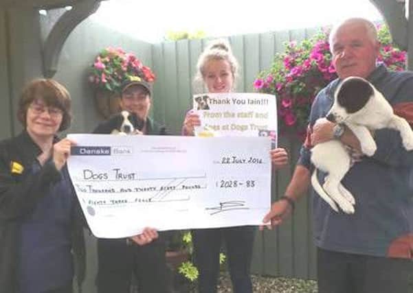 Dogs Trust Ballymena staff and canine residents, Captain and Admiral thank Iain for his efforts. Submitted image.