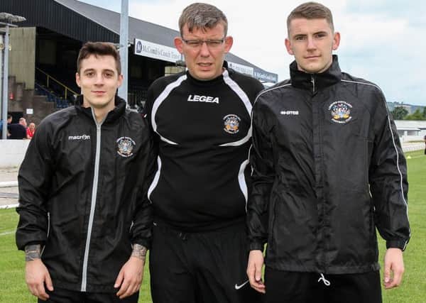 Lisburn Distillery announced two further signings on Saturday. Darren Bell (left) and Tirrell McCrory (right) are pictured with manager Colin McIlwaine. Picture - David Hunter.
