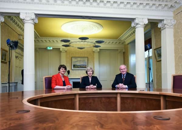 Prime Minister Theresa May (centre) with First Minister Arlene Foster (left) and Deputy First Minister Martin McGuinness at Stormont Castle in Belfast, as she said that the UK's departure from the European Union (EU) must work for Northern Ireland. PRESS ASSOCIATION Photo. Picture date: Monday July 25, 2016. Mrs May said she wanted to "engage with" all of Stormont's parties as she travelled to Belfast. See PA story ULSTER May. Photo credit should read: Charles McQuillan/PA Wire