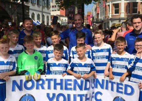 Northend U11s with team coaches Paul Adams, Joe Kidd, and Niall Kelly at the Foyle Cup.