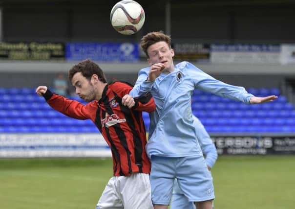 Institute's Caolan Cooley wins this header during their pre-season friendly win over Strabane Athletic. INLS3016-105KM