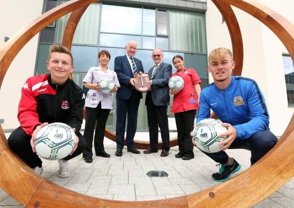 Ross Holden, Crusaders (left), Mark Sykes, Glenavon (far right), l-r Patricia McCabe (NI Hospice Auxiliary Nurse), Adrian Teer, chairman NIFL and Glenavon, Sir Bruce Robinson, NI Hospice and Debbie Sharkey, NI Hospice, help launch the NI Hospice Charity Shield final between Irish Premiership champions Crusaders and Irish Cup winners Glenavon at Mourneview Park on Saturday. Kick-off at 3.00pm.