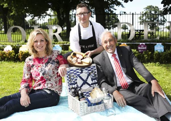 Moira-based Great British Menu Chef Chris McGowan, Wine & Brine, serves up a local picnic to Councillor Uel Mackin, Chairperson for Lisburn and Castlereagh City Council Development Committee and Event Organiser Joanne McErlain, Babble, including charcuterie and cheeses available at the upcoming Speciality Food Fair Moira, Saturday 20th August at Moira Demesne.  Organised by Lisburn and Castlereagh City Council, this yearÃ¢Â¬"s fair will see over 40 small-batch artisan producers from as close as Moira and as far as Derry gather for an afternoon of kitchen sessions led by esteemed local chefs, opportunities for customers to interact with and purchase directly from artisan producers, and outdoor areas to enjoy the best of Northern IrelandÃ¢Â¬"s local produce and artisan goods al fresco. For more information on the many local producers confirmed for this yearÃ¢Â¬"s fair visit http://www.visitlisburncastlereagh.com/.