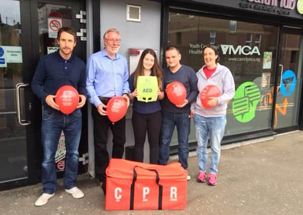Adam Hamilton (YMCA project worker); Ivor Mitchell (YMCA general secretary); Emma McGuinness (Gateway volunteer); Thomas Haighton (Gateway leader), and Karen Graham (youth manager) present the AED to Carrickfergus YMCA.  Emma completed a charity skydive earlier this year, raising over Â£850 to purchase the equipment.  INCT 31-720-CON