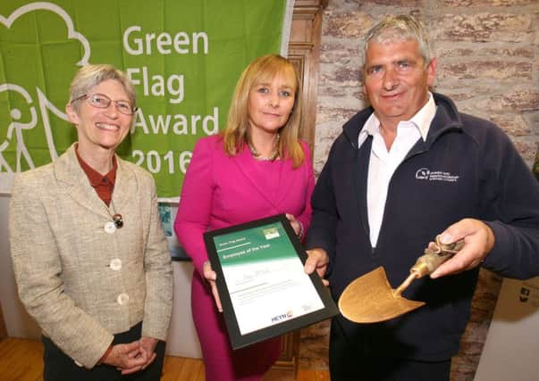 Cemeteries Supervisor Kenny McFall receives the Green Flag Employee of the Year Award from Michelle McIlveen MLA, Minister for Agriculture, Environment and Rural Affairs and Sue Christie, Keep Northern Ireland Beautiful Vice Chair. INNT 30-516CON