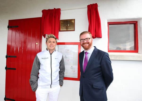 One Direction singer Niall Horan pictured with Economy Minister Simon Hamilton at the opening of the new fun golf area at Galgorm Castle, ahead of this week's Tayto Northern Ireland Open, in partnership with Ulster Bank. Picture: Press Eye.