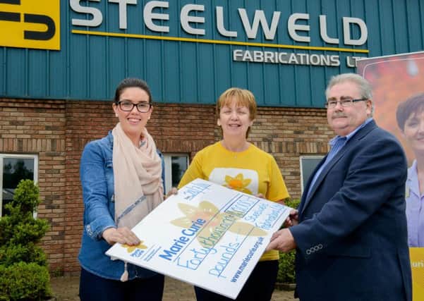 Sandra Spence, community fundraiser with Marie Curie is pictured as she receives a cheque for Â£40,000 from Steelweld, Cookstown. Handing over the cheque - which was raised through various fundraising activities throughout the year culminating with a Gala Ball at the Greenvale Hotel - is Dominic Crilly Steelweld MD and Brogagh Graham, HR manager for Steelweld.