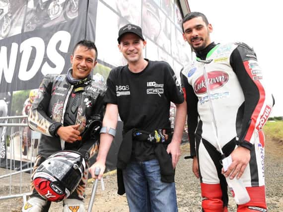 Ryan Farquhar (centre) with Czech rider Michal 'Indy' Dokoupil (left) and Derek Sheils at the Armoy Road Races on Friday.