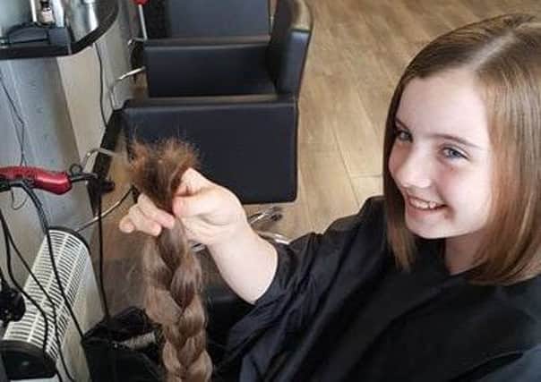 Sarah Clements had her hair cut for the Little Princess Trust.  INCT 31-729-CON