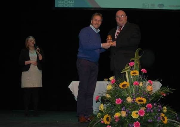 Denver McMeekin pictured receiving the Man of the Year award from Tony Morrison at last years awards.