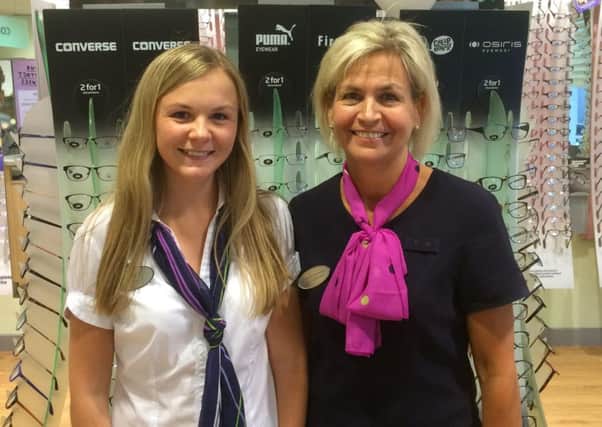 Optometry student Ruth Gracey (left) with Ballymena Specsavers store director Valerie Penney.