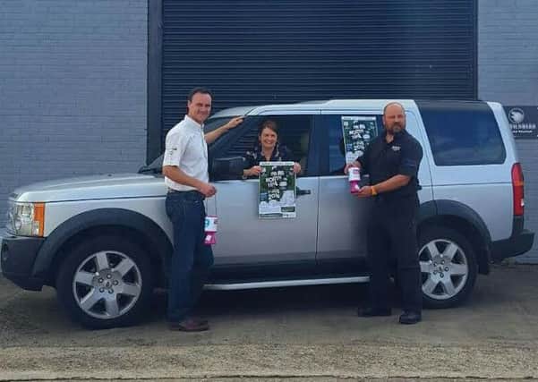 Stephen Laughlin and Marty Magill from Beyond Performance 4x4 pictured with Nadine Campbell from CLIC Sargent.  INCT 31-731-CON