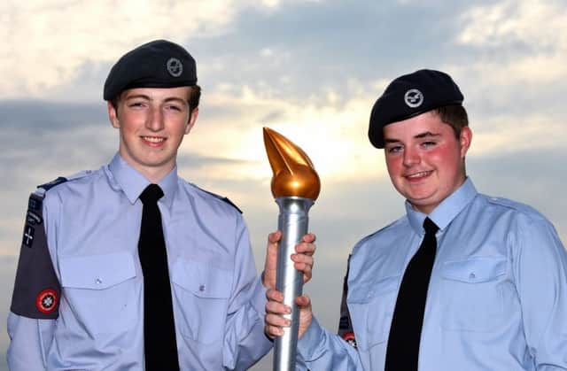 2016 marks the 75th anniversary of Air Cadets and, in Northern Ireland, local Cadets have been celebrating the occasion by taking part in a national Torch Relay.  Cadet Corporal Connor Slane from Antrim and Cadet Kevin Heffron from Randalstown raise the anniversary torch.