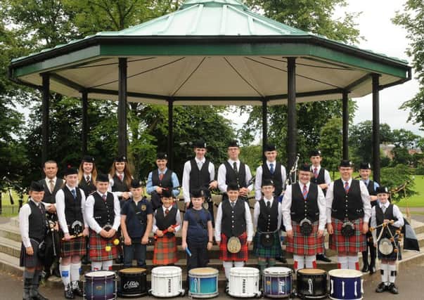 Pipe Major Andy McGregor (left in back row) and the Ulster-Scots Agency Juvenile Pipe Band pictured after performing at an open air concert in Wallace Park, Lisburn on Sunday afternoon 31st July as part of the Lisburn & Castlereagh City Council Park Life summer programme.