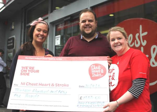 Lynsey and Gary Elliott hand over a cheque for Â£1,355 to Cheryl Brown, Northern Ireland Chest Heart & Stroke fundraiser. INNT 32-503CON