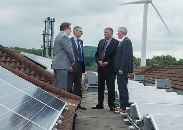 Checking out the new solar panels on the roof of Antrim Area Hospital are Peter McConaghie, Energy and Environment Manager; Tony Stevens, Chief Executive, Northern Trust; Mervyn McNeil, Acting Assistant Director/Head of Estates and Paddy Graffin, Head of Support Services.