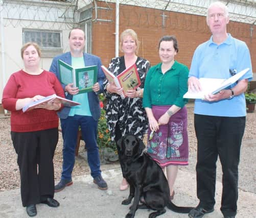 Tony Macaulay (second from left), is pictured at the presentation of his trilogy of books which have been reproduced in braille by prisoners in Maghaberry for Lisburn Library. Included are Margaret Mann, Hazel Flannigan and David Mann, all braille unit volunteers in Maghaberry, and Diane McCready, Lisburn Library Manager.