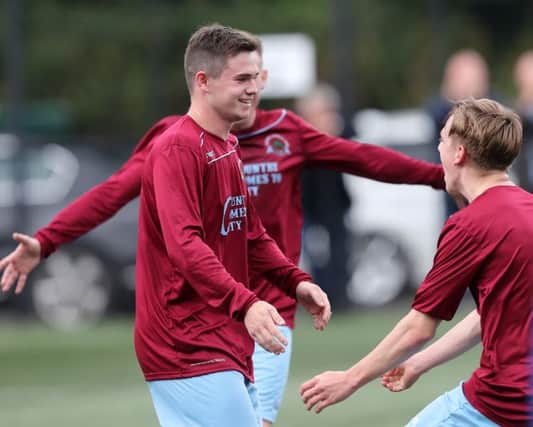 Institute's Michael McCrudden (left) is congratulated by team-mate Ciaron Harkin after scoring his team's first goal in their 3-1 win over Moyola Park.