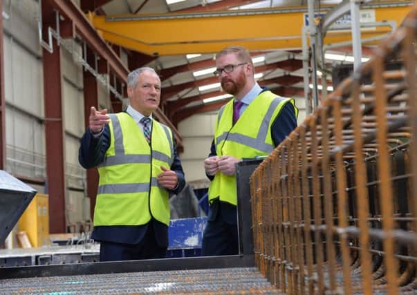 Economy Minister Simon Hamilton on a visit to Moore Concrete Products Ltd Ballymena with MD Wilbert Moore. Moore Concrete Products Ltd is a manufacturer of bespoke pre-cast concrete products.
Photo by Aaron McCracken/Harrisons